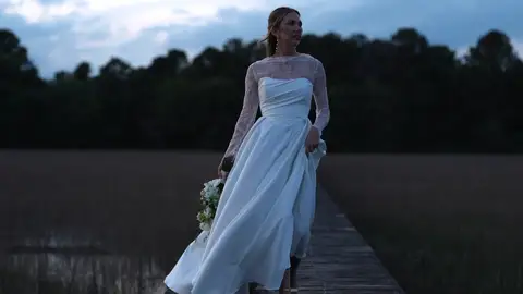 Bride on a dock at dusk